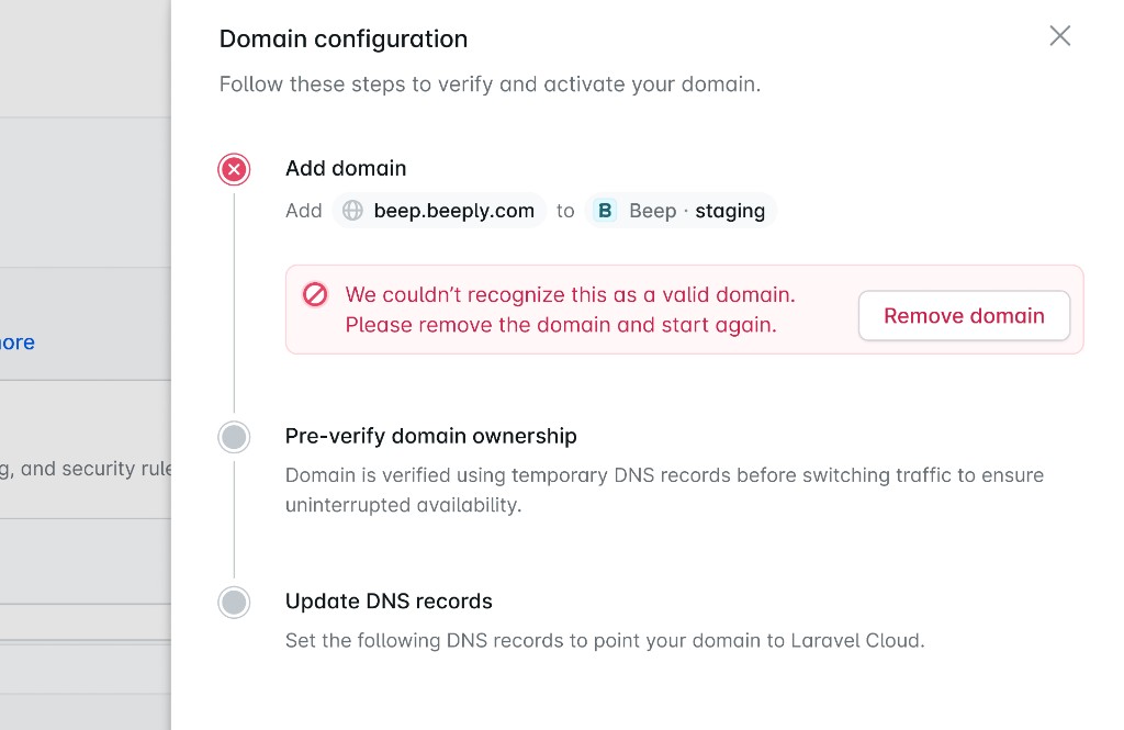 Laravel Cloud domain setup showing an invalid domain error with a remove domain action
